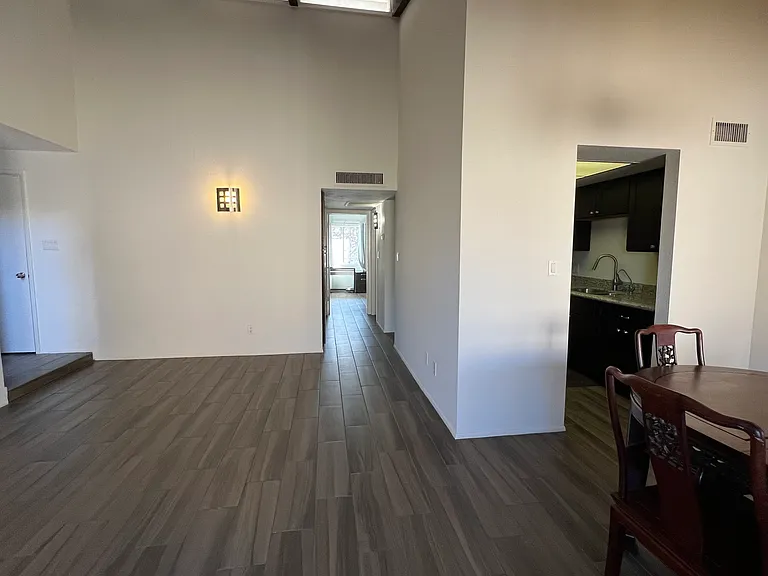 7ViewFromLivingIntoKitchen&HallwayToBaths&BR