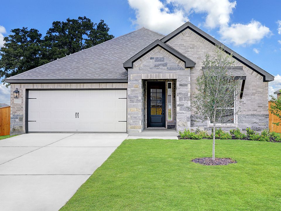 Exterior of the Connally with light gray brick and stone and professional landscaping.