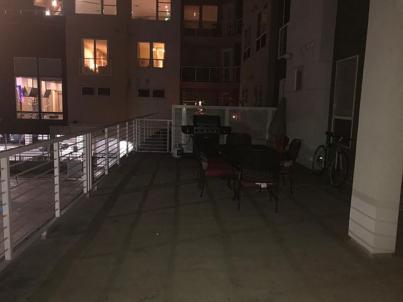 Massive patio overlooking the pool, city, and mile high staf