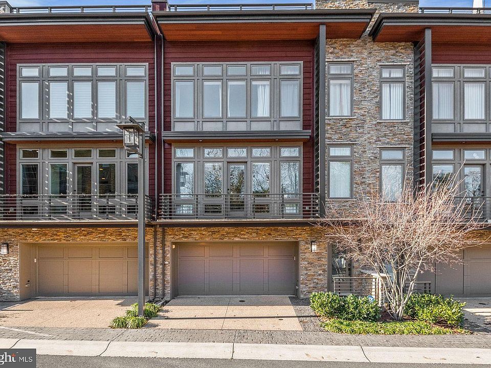 Little Falls Place Townhomes - 2 car garage with entrance to basement level. Front Door foyer with coat closet