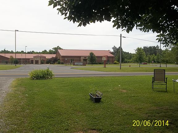 sits across from schools