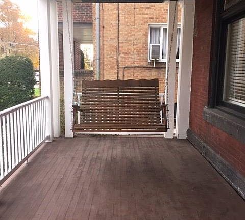 Front porch with swinging chair