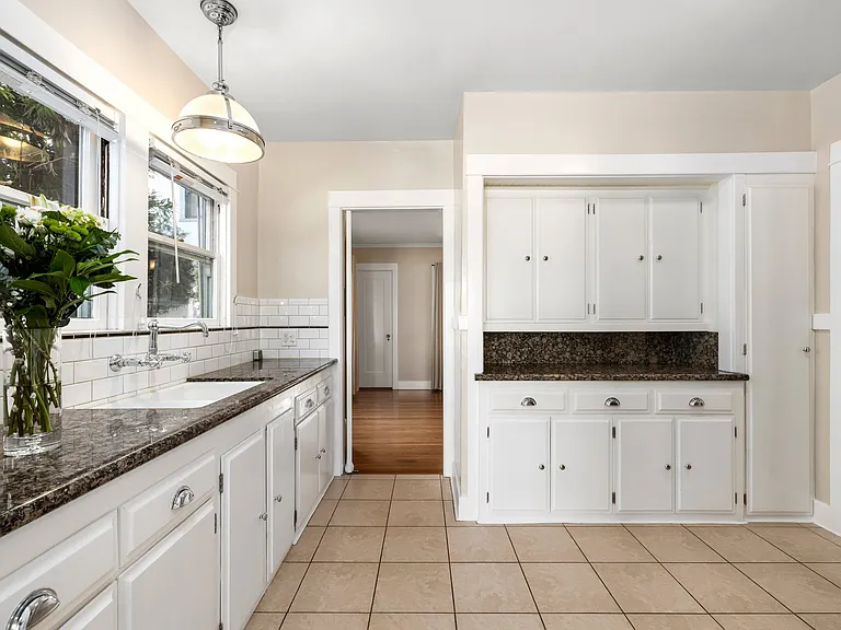 Kitchen with Cabinetry & Granite Countertops