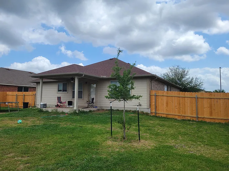 Covered patio, new fence all around.