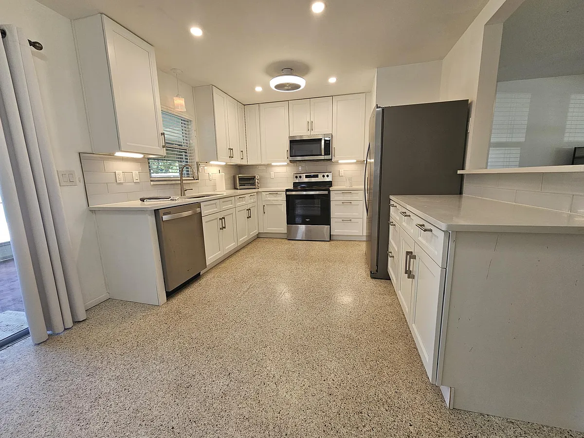 Totally remodeled and updated kitchen with all new appliances about 12 months ago. Quartz counter tops. 
Overlooks screened in lanai. Under counter lights. - 7508 2nd Ave NW