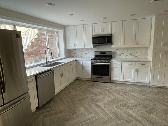 Kitchen with new stainless steel appliances