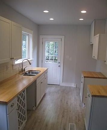 The kitchen has upgraded custom cabinets