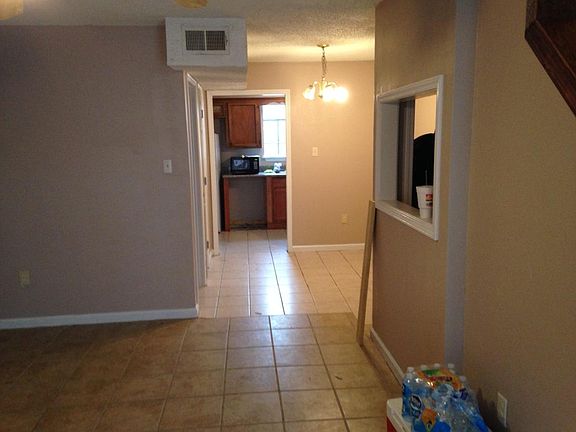 living area with view into kitchen