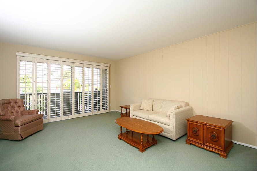 Living room wit hsliding door to balcony