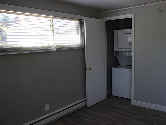 Stackable washer/dryer in closet.