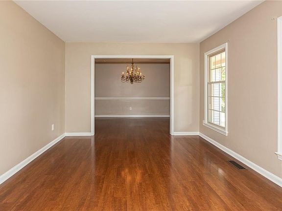 Formal living room with floor to ceiling windows