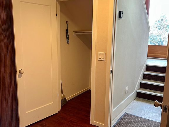 Entrance four steps down from ground level.
