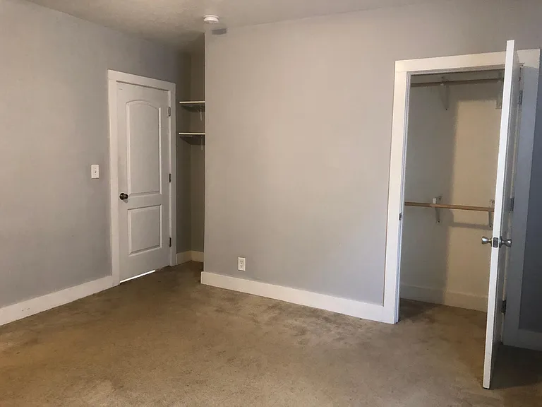 Spacious closet and extra shelving for storage