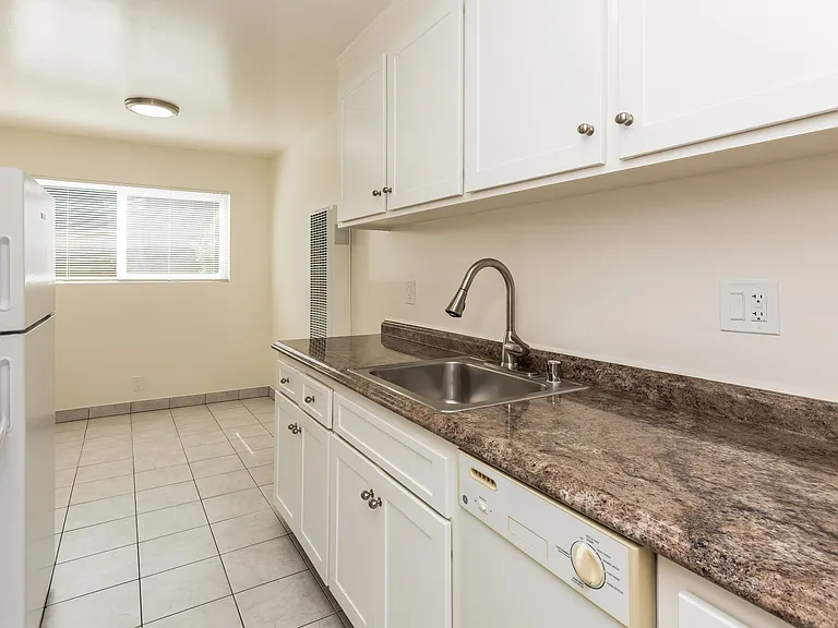 KITCHEN - Angle #3
* This is a typical apartment. Some features may vary from apartment to apartment such as the counter tops and tile colors, etc. but most will be nutral colors.