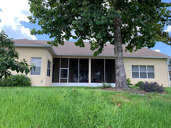 Rear of House looking at enclosed lanai.