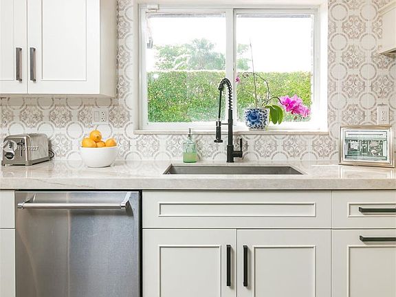 Kitchen overlooks Back Yard