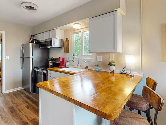 Expansive butcher block counter offers perfect cooking and dining space
