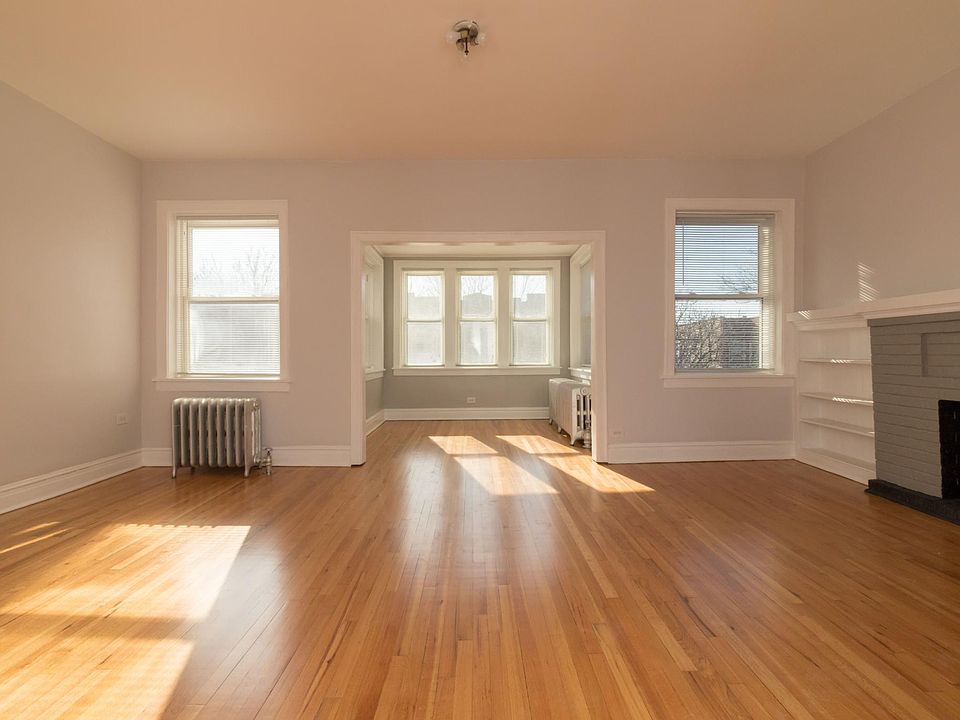 Living room with Sun room in Background