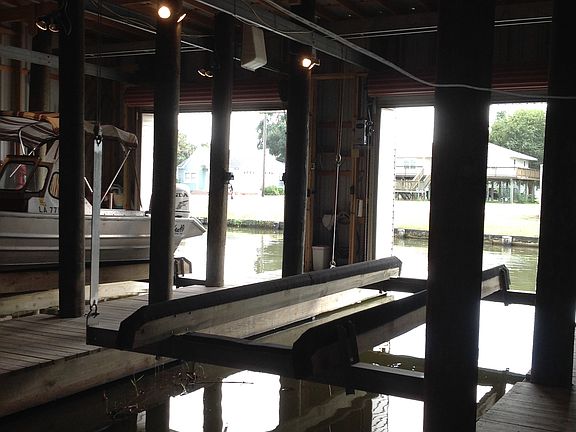 Double boat lift in shed