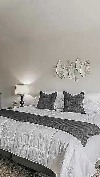 Well-appointed bedroom with a large walk in closet.