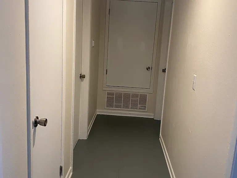 Long hallway. Budget priced painted flooring.
