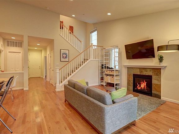 View of large living room, eat in area of Kitchen & stairs to Master Suite.  