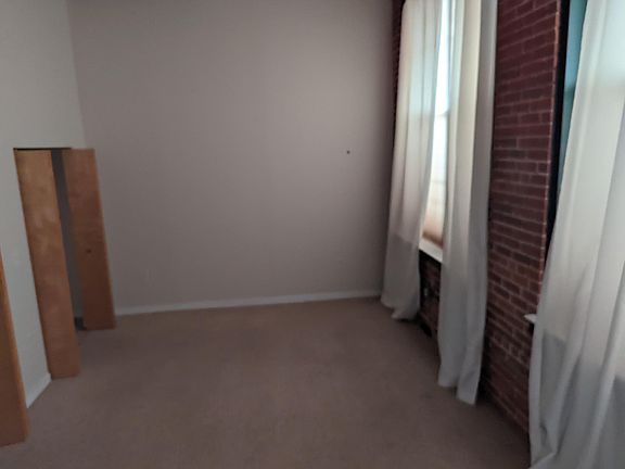 Smaller bedroom, still HUGE and double closet goes from wall to wall.