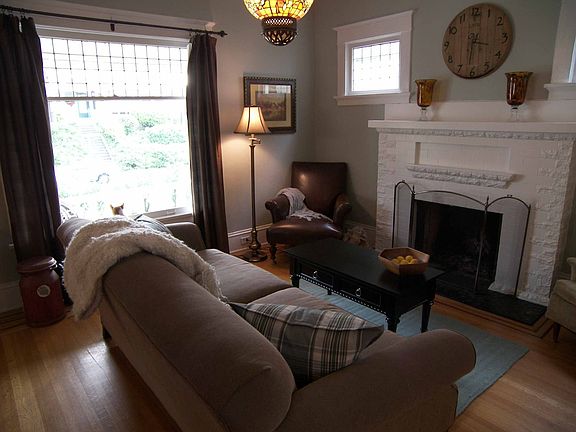 Living Room with lots of natural light and wood buring fireplace 