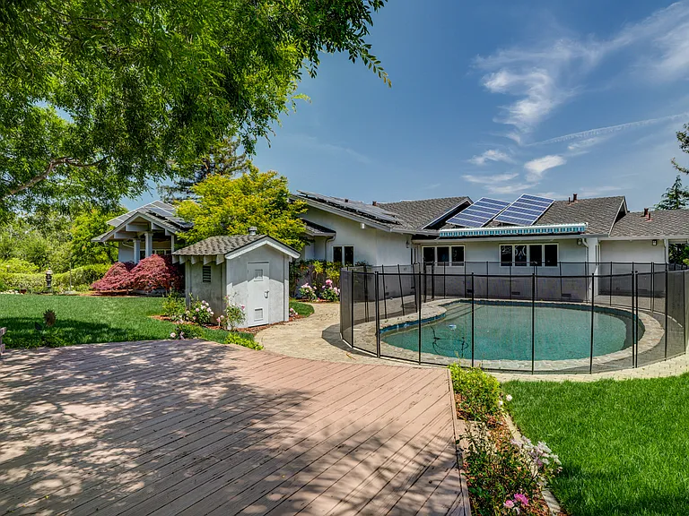 A sparkling pool at the front and a wonderfuldeck beckoning for entertainment or relaxation.