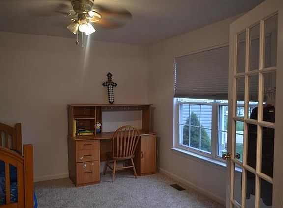 this bedroom can easily be changed back to a den or formal living room.  Simply by changing out the furniture.
