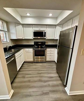 Updated kitchen off of dining room open area with all stainless dishwasher, Range, and Refridgerator; granite countertops; soft close cabinet doors,