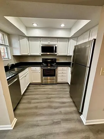 Updated kitchen off of dining room open area with all stainless dishwasher, Range, and Refridgerator; granite countertops; soft close cabinet doors,