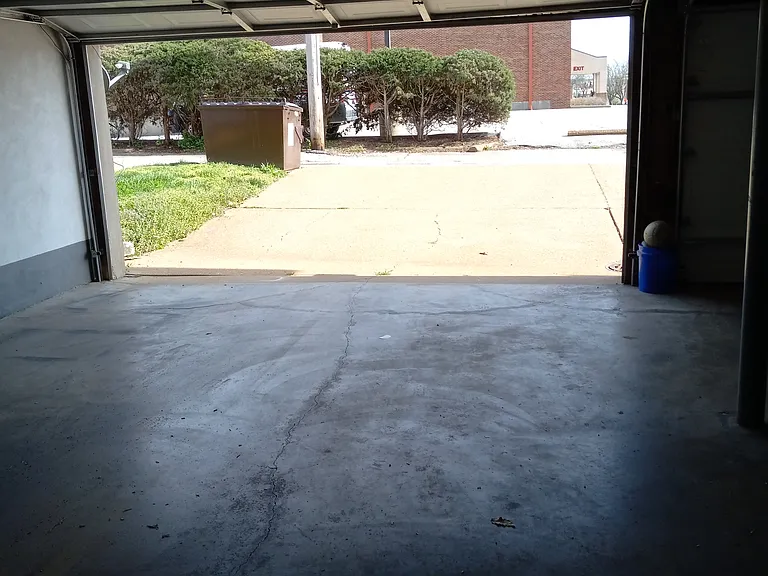 Garage (attached to building). Walk-thru to residence without leaving building.