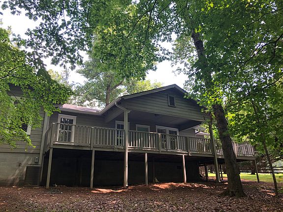 Rear deck wraps around on two sides. Overlooks stream and horse meadow.