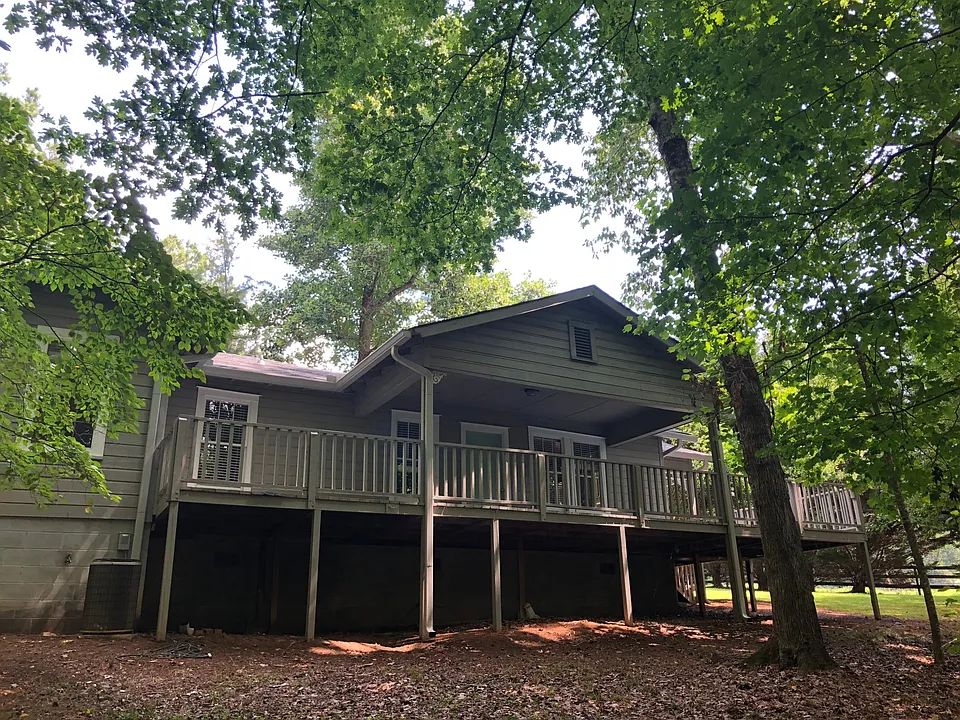 Rear deck wraps around on two sides. Overlooks stream and horse meadow.