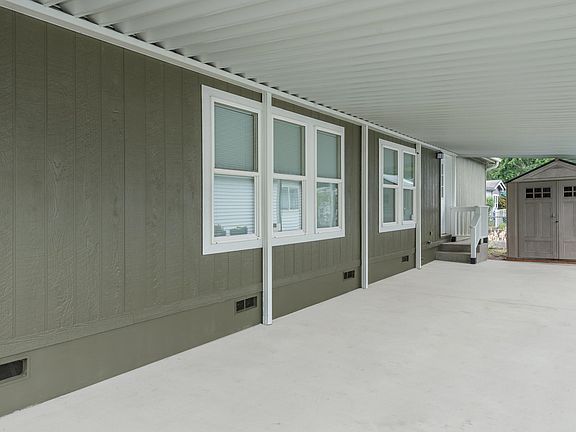 Carport with shed