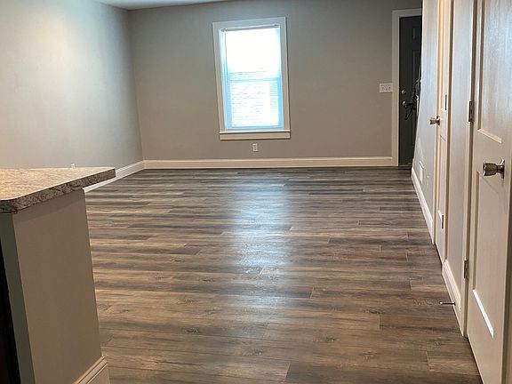 Living room off the kitchen. To the left of this photo is the full size laundry closet, and the half bath.