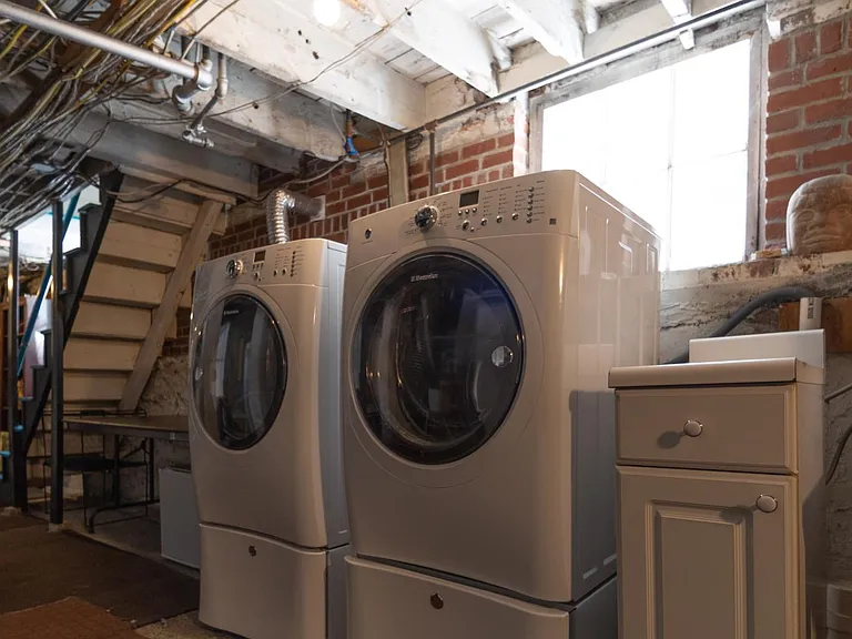 Shared washer & dyer in basement