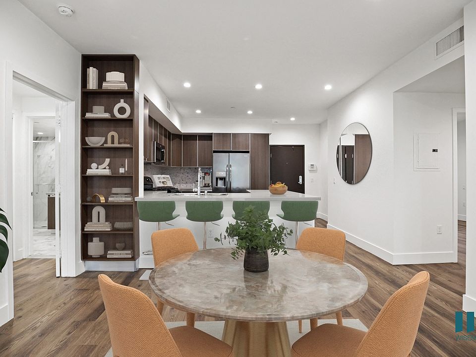 Kitchen with Countertop Bar, and Dining Room with Built-In Shelving