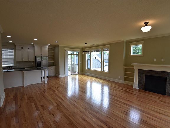 Large open floor plan with gas fireplace, built-ins, dining area and beautiful kitchen