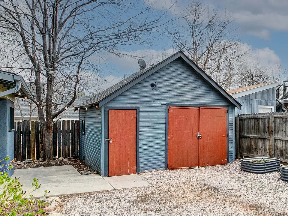 garage is shared storage for bikes, etc. Four raised, irrigated garden beds are installed on south property edge