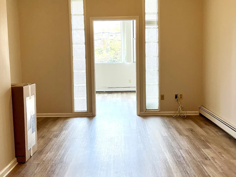 Large livin room area with wood floors