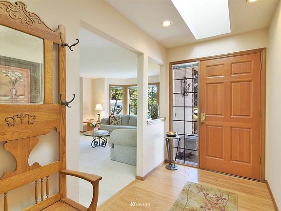 An abundance of Northwest light flows into the home from the numerous skylights and surrounding windows of the home.  Formal entry features bamboo floors!>