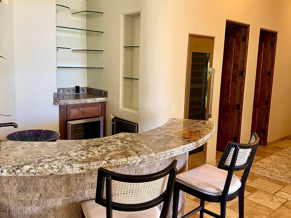 Open concept bar with wine fridge