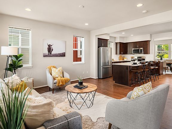 Gleaming hardwoods boast in this stunning naturally lit living space. With soaring ceilings the living room seamlessly blends into the adjoining kitchen and dining space - perfect for entertaining!