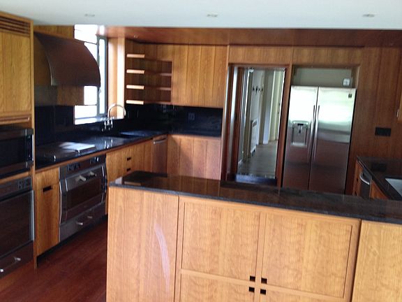 Kitchen with two dishwashers and two sinks, all new applianc