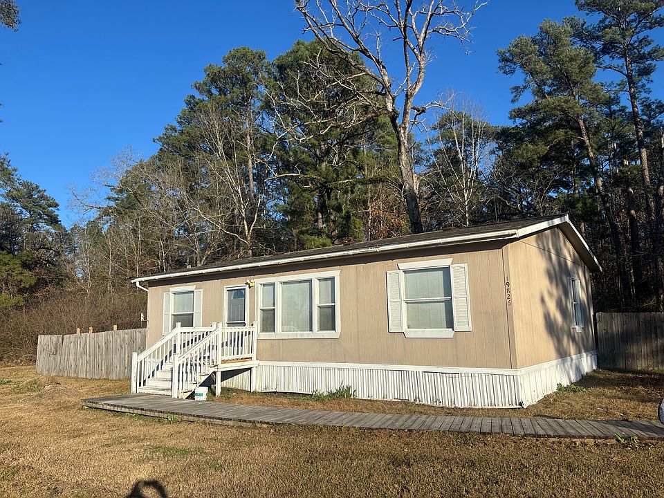 Front of home with boardwalk entry.