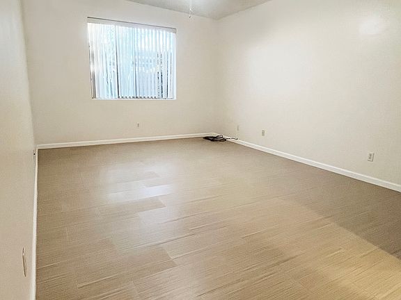 Master bedroom with tile flooring