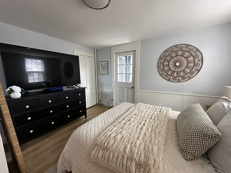 Bedroom with back porch entry.