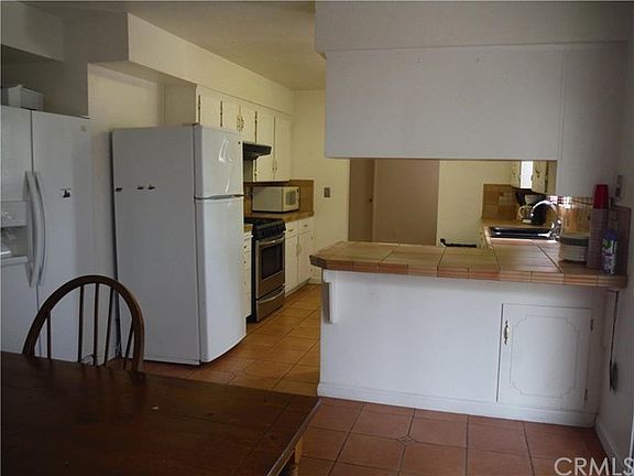 View from the eating area off the kitchen picture show 2 refrigerators